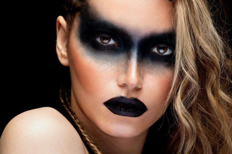 Model with striking black nail design and makeup, at Armani Nail Boutique, the best in the heart of Vancouver.