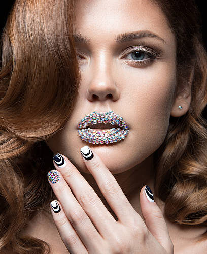 Model with black and white nail art and jeweled lips, at Armani Nail Boutique, the pride of Vancouver.